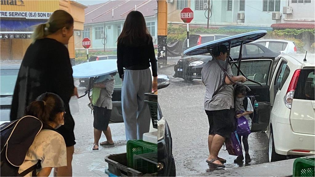 父單手扛「大圓桌」替孩擋超猛豪雨　「這一幕」網讚爆：超人爸爸！